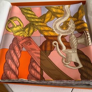 New Hermes scarf in box with tags. Mostly rose, gray and yellow.